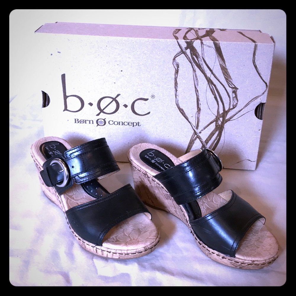 Black leather cork wedge slip on sandals.